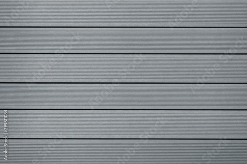 Top view of WPC in grey color. WPC: Wood-Plastic Composites are wood fiber and thermoplastic such as PE, PP, PVC, or PLA. A WPC decking are stylish and enrich the outdoor living