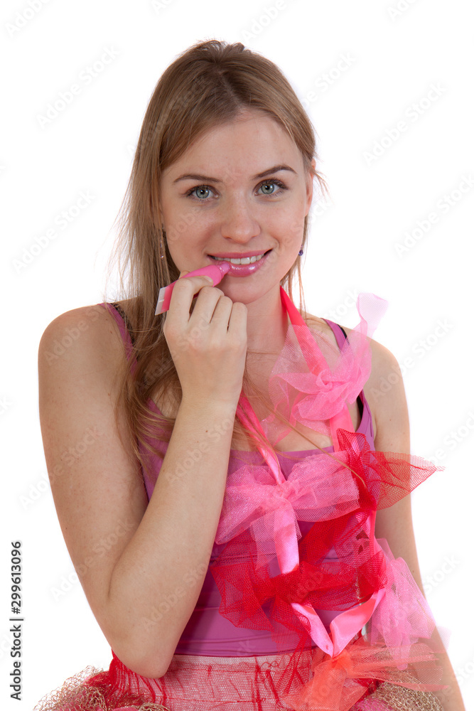 Young beautiful girl paints her lips and smiles Young beautiful girl paints her lips and smiles