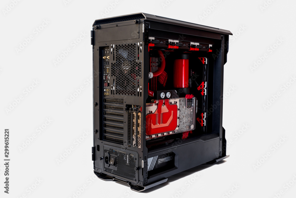 	 Open computer with water cooling system, processor, graphics card, motherboard fan Game console behind white background