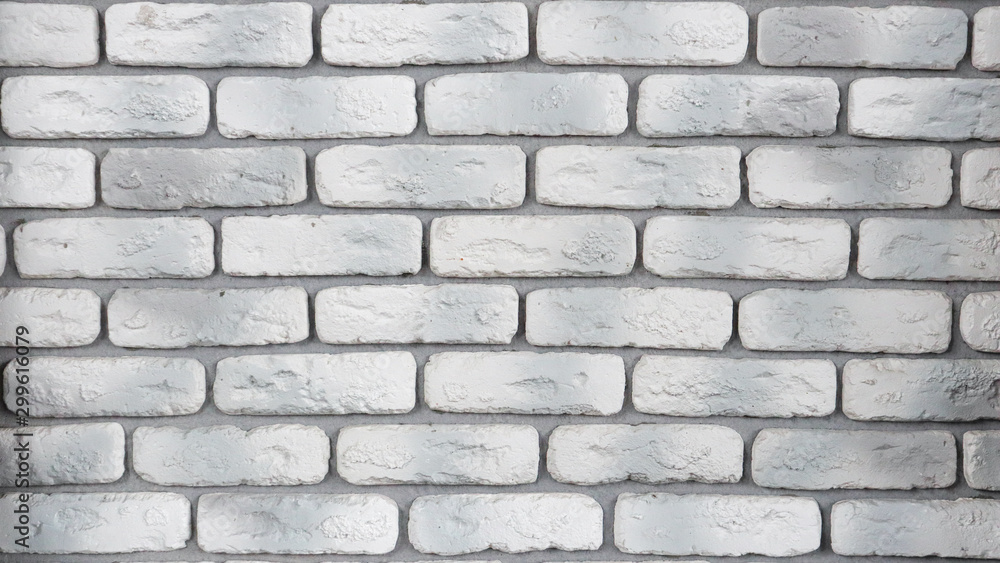 Modern white with gray brick wall texture for background. Abstract weathered texture painted with old stucco light gray and aged paint white brick wall background, grunge blocks of stone. Modern white with gray brick wall texture for background. Abstract weathered texture painted with old stucco light gray and aged paint white brick wall background, grunge blocks of stone.