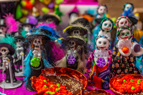 Glass and sequin sugar Calaveritas dolls, typical sweets during the time of the day of the dead in Mexico, toy offerings made with crumbs and icing sugar