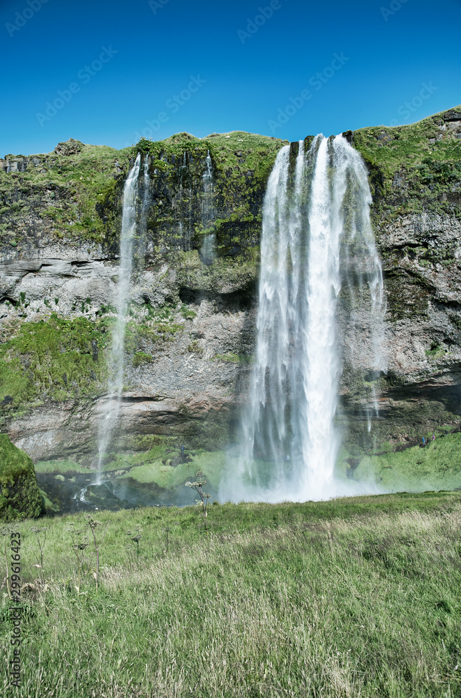 Beautiful view of Seljalandfoss Waterfalls in Iceland on a sunny summer day