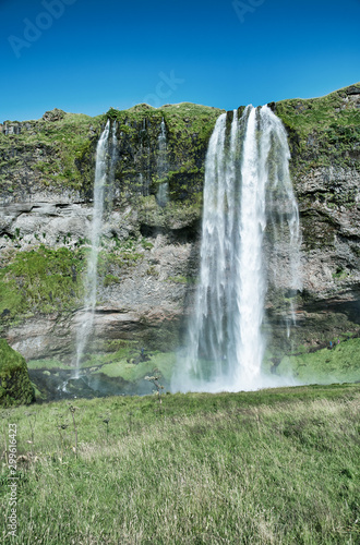 Beautiful view of Seljalandfoss Waterfalls in Iceland on a sunny summer day