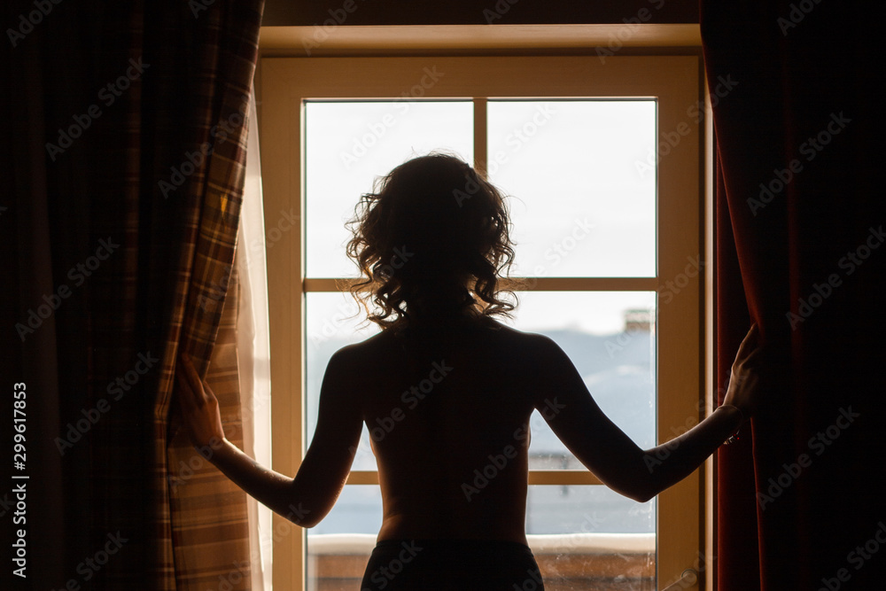 Fototapeta premium woman in window