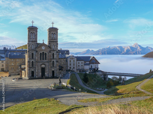 Shrine of Our Lady La Salette above the clouds. Sanctuary in the town of La Salette-Fallavaux in the Provence-Alpes-Côte d'Azur. Hautes-Alpes, French Alps, France photo