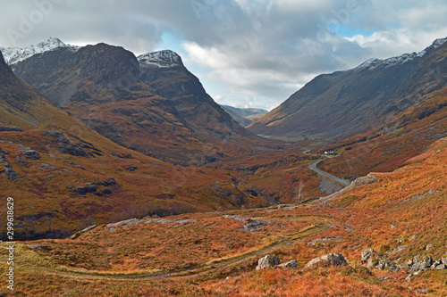 Classic valley view of Glencoe as Autumn/Fall turns to winter. Autumn foliage and snow capped mountains.