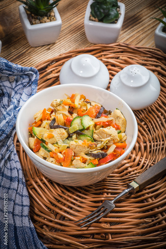 Fried chicken pieces with vegetables.