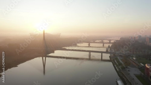 Wallpaper Mural Drone landscape shot in the city of Warsaw, Poland.  Aerial view of the Warsaw sky, river, bridge and roadway at sunrise on a foggy morning. Torontodigital.ca