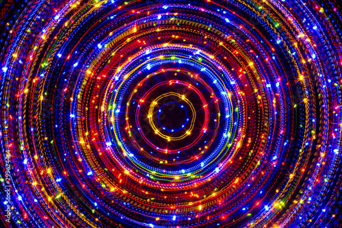 Circle neon lights with sparkling dots, bright colorful laser lights background, modern nightlife and party concept, disco and dancing nightclubs pattern