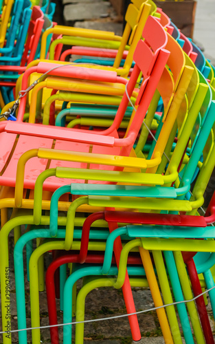 Bright colored chairs of a street cafe