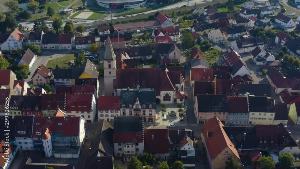 Aerial view of the city Geisingen in Germany. On a sunny day in summer. Tilt down on to the church.