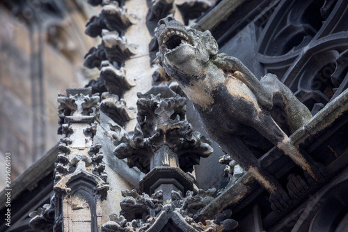 Elements of Gothic architecture. Grotesque, chimera and gargoyle sculptures on the facade of an ancient medieval cathedral. St. Stephen's Cathedral. Vienna. Austria © Sodel Vladyslav