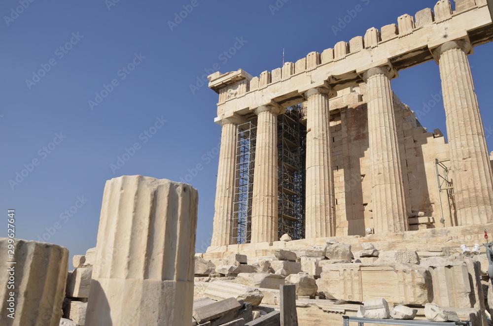 Obraz premium Athens, Greece, 10.28.2019. Ruins of Parthenon temple on a bright day in Athenian Acropolis - world heritage site. Religious building of ancient times.