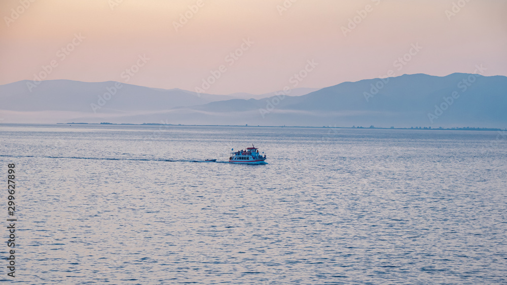 small boat sailing at Aegean sea Greece small boat sailing at Aegean sea Greece