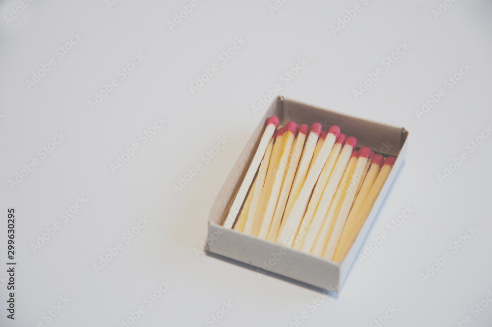 matches are in a box on the table. On white background matches are in a box on the table. On white background