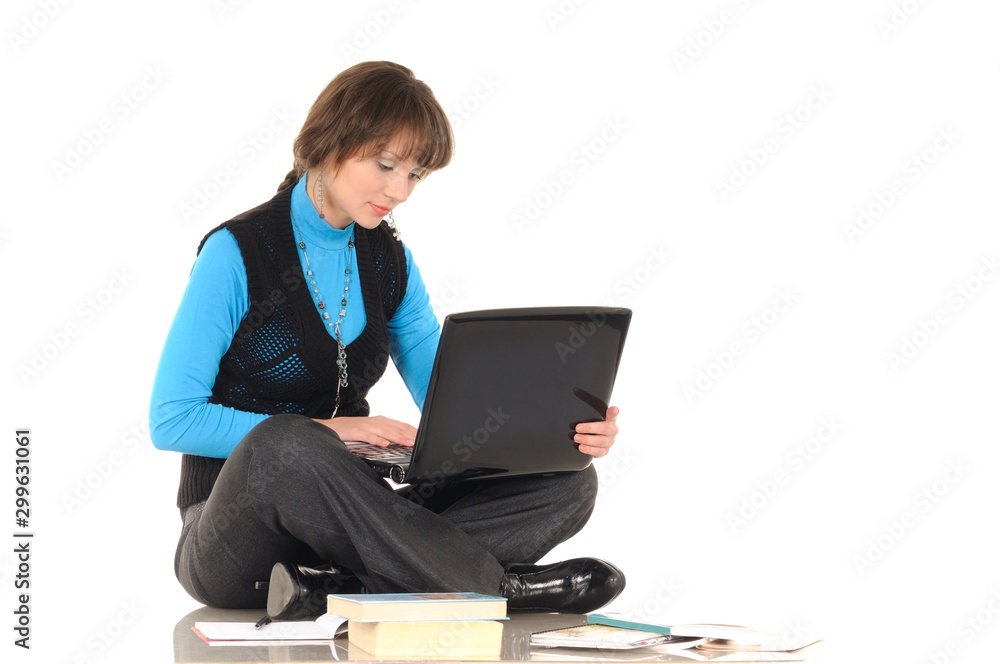 Photo of naughty student girl with brown hair in black suit with personal computer posing at camera, isolated on white Photo of naughty student girl with brown hair in black suit with personal computer posing at camera, isolated on white