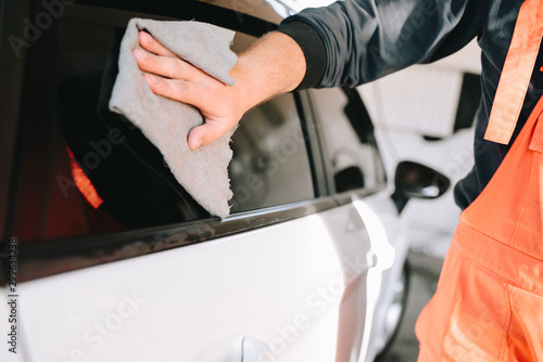 Male hands cleans car interior on carwash station © mrsmitt22