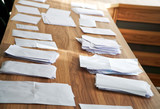 Sheets of paper collected during a poll, referendum, questionnaire or election, with the wishes of citizens, are on the table systematized and ready to be counted