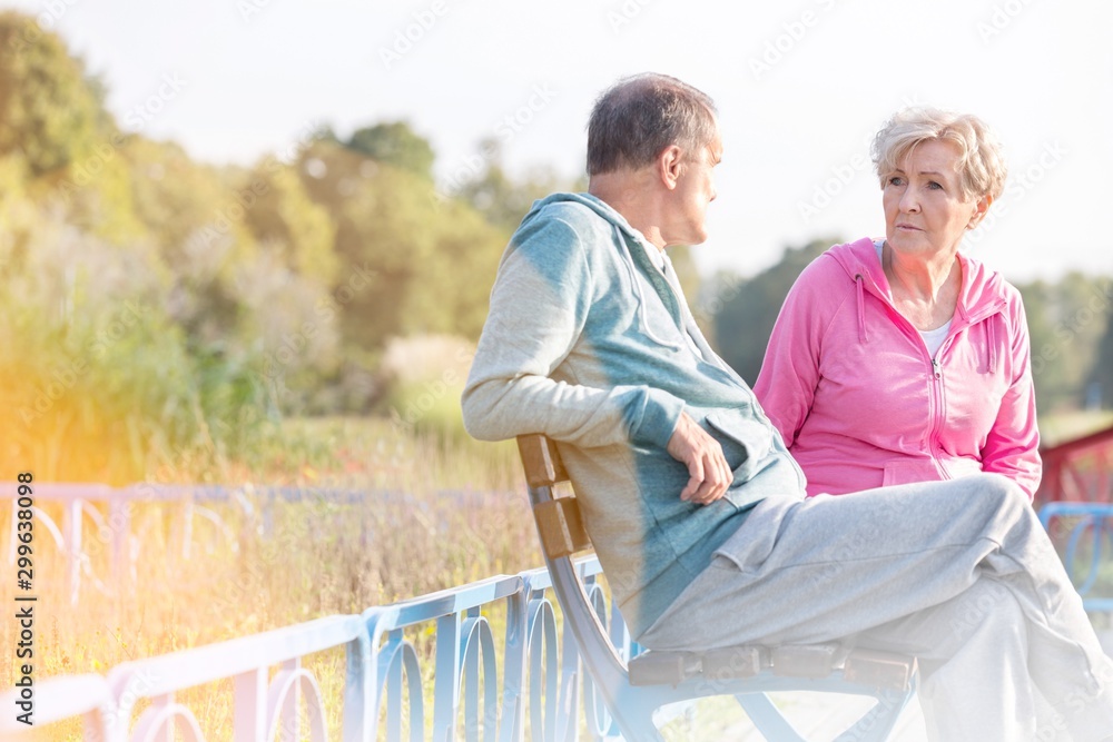 Active senior couple in park