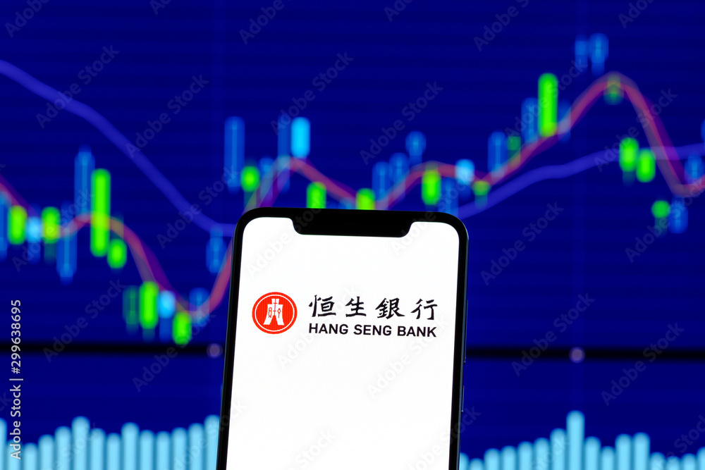 Hang Seng Bank logo is seen on an smartphone over stock chart Stock Photo |  Adobe Stock