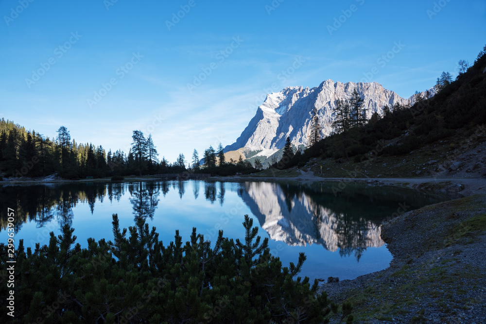 lake seebensee in the early morning, with reflecting mountain of Zugspitze