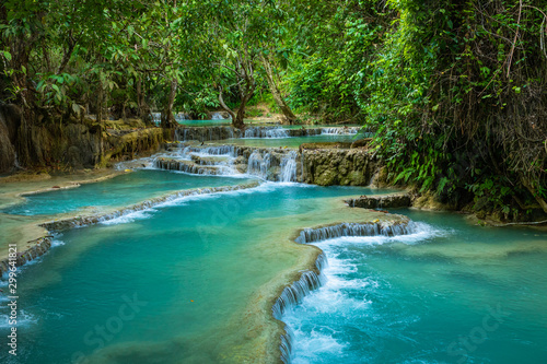 Turquoise water of Kuang Si waterfall, Luang Prabang, Laos. Tropical rainforest. The beauty of nature.