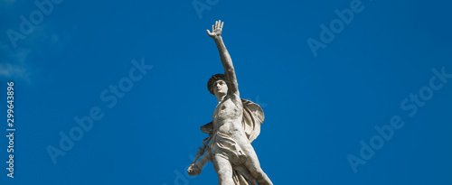 Ancient statue of antique god of commerce, merchants and travelers Hermes (Mercury). He is olympic gods messenger with wings on his feet and helmet.