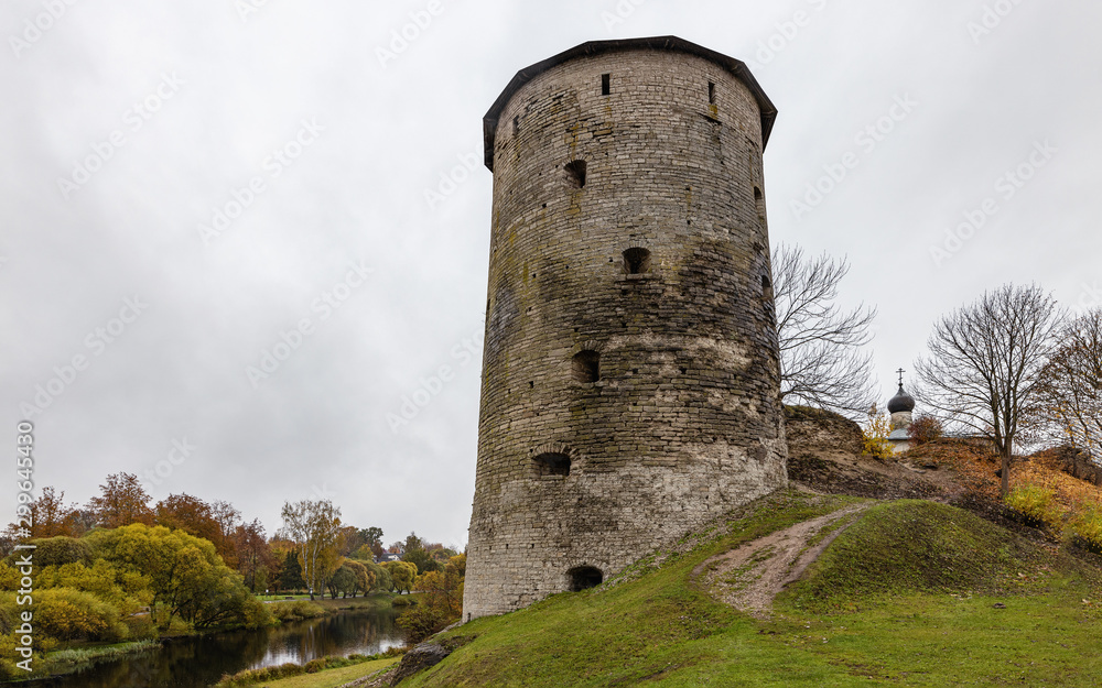 A dilapidated Gremyachaya tower on Gremyachaya hill in Pskov on the Bank of the Pskova river A dilapidated Gremyachaya tower on Gremyachaya hill in Pskov on the Bank of the Pskova river