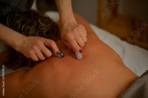 woman getting a stoun massage photo