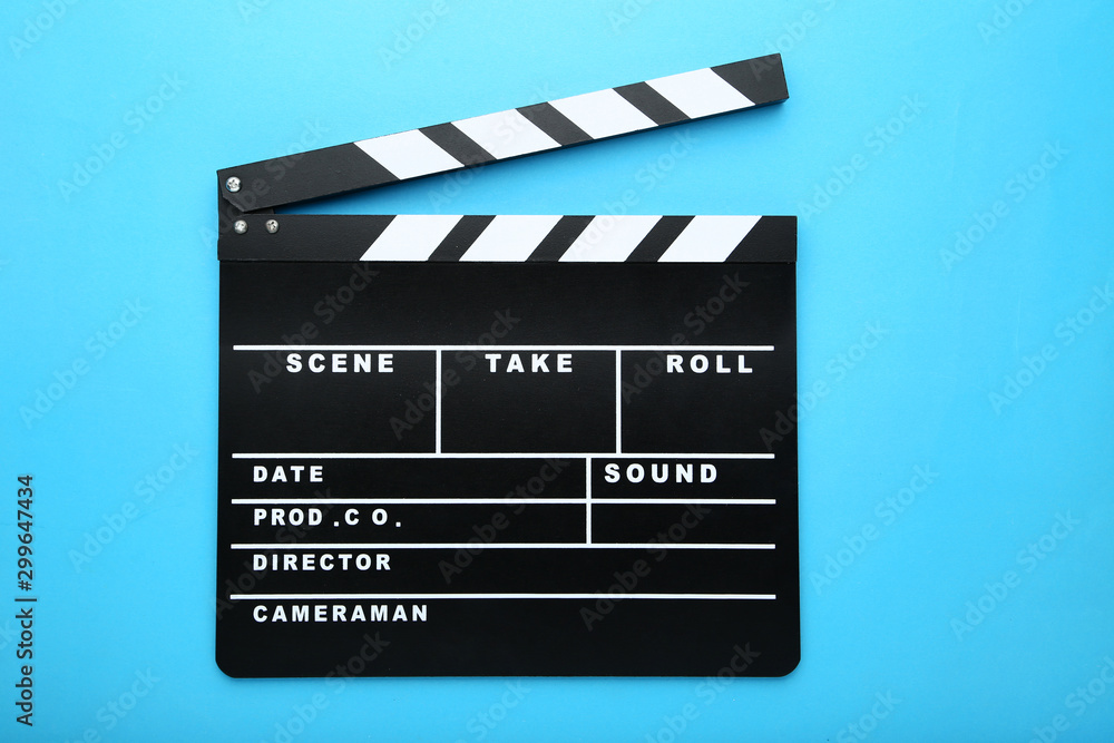 Clapper board on blue background