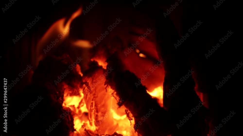 A steady slow motion shot of a wood burning fire and embers A steady slow motion shot of a wood burning fire and embers