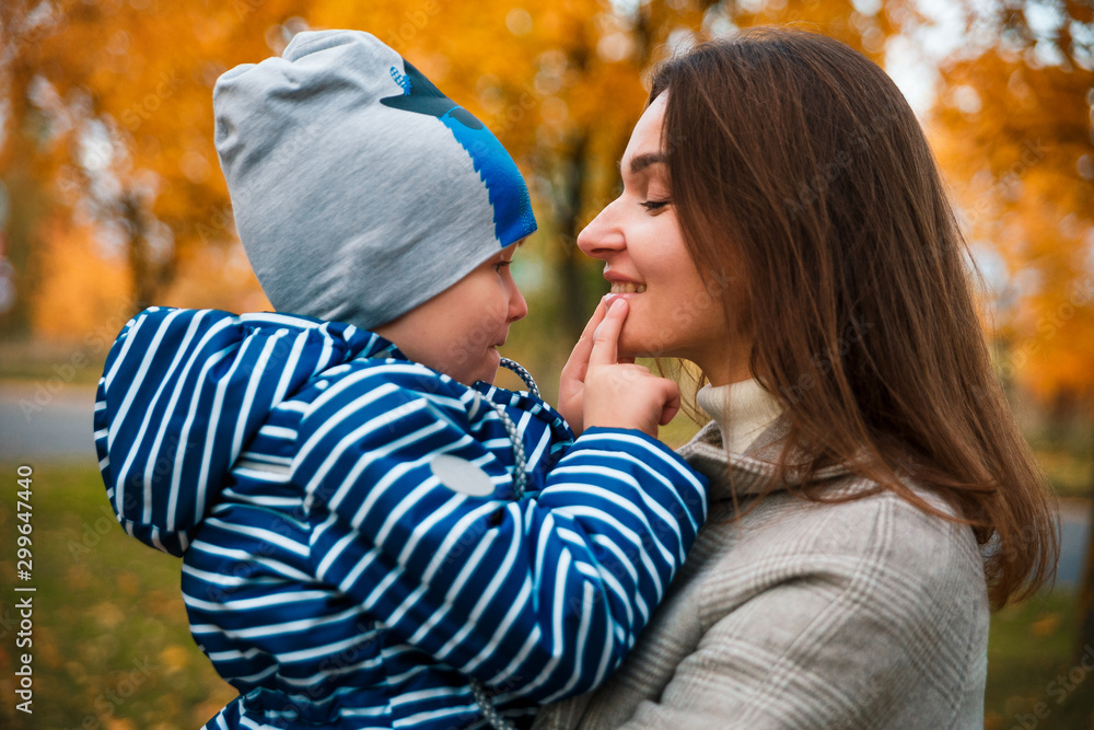 Fototapeta premium mom having fun with her son on a walk.portrait photos of mother and son
