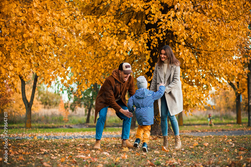 family on autumn walk.photo of a young family