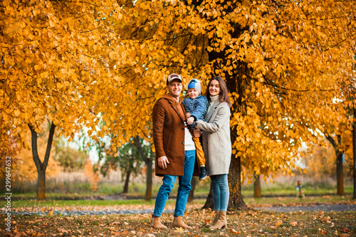 family on autumn walk.photo of a young family