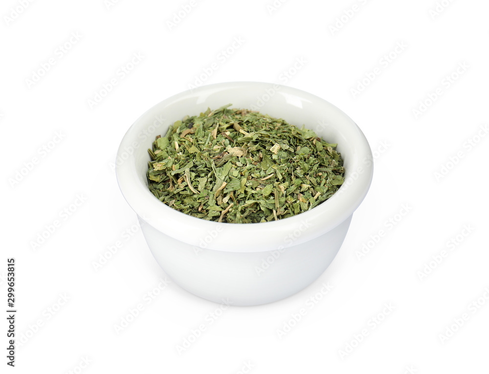 Bowl with dried parsley on white background Bowl with dried parsley on white background