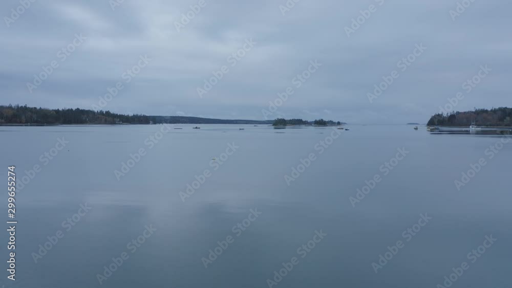 Aerial over reflective flat calm water coast Dusk Aerial over reflective flat calm water coast Dusk