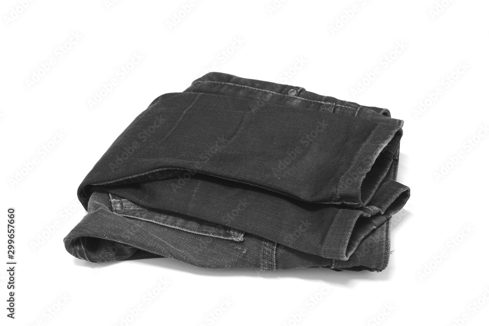 Stack of various blue jeans on white background. Stack of various blue jeans on white background.