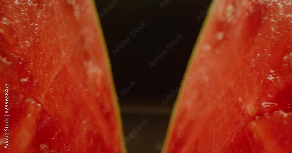 Macro shot of two half of watermelon, zooming into watermelon crack, vibrant juicy fruit, red epic, close up of ripe berry Macro shot of two half of watermelon, zooming into watermelon crack, vibrant juicy fruit, red epic, close up of ripe berry
