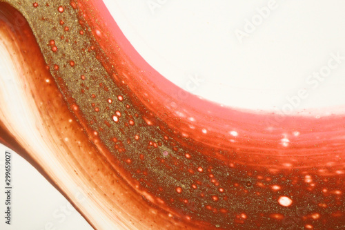 Section of an abstract painting in pink, brown, metallic gold, and white that looks like a swipe of melted ice cream for backgrounds.