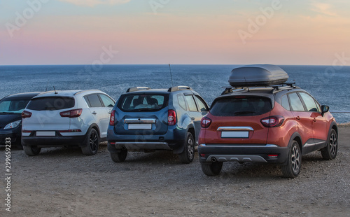Cars on a sandy beach © Yuri Bizgaimer