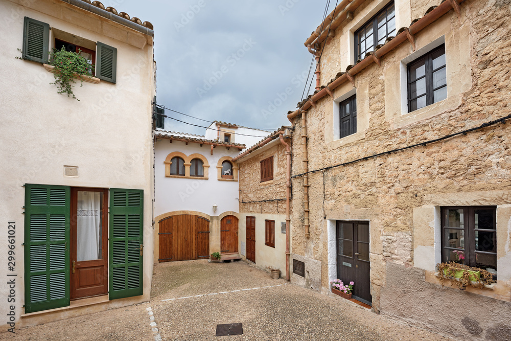 Scenic courtyard in old residential neighborhood. Village Capdepera, island Majorca, Spain.