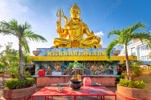 Ramintra Road, Bangkok, Thailand - October 27, 2019 : Shiv Temple  - Golden Shiva Statue photo