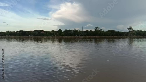 Tenggarong, Kaltim, Indonesia, Pulau Kumala shore, Mahakam river scene circa December 2018 photo