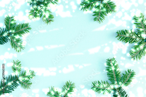 Christmas modern composition. Branch fir on pastel blue background. Christmas, New Year, winter concept. Flat lay, top view, copy space