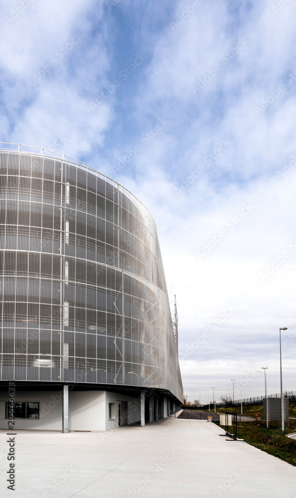Modern parking building with large aerated facade Modern parking building with large aerated facade
