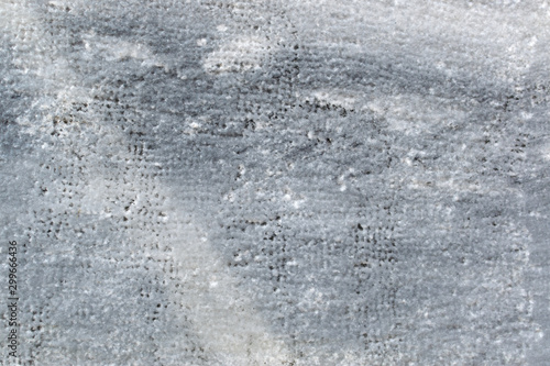 texture of gray marble. fragment of a wall made of natural stone, background