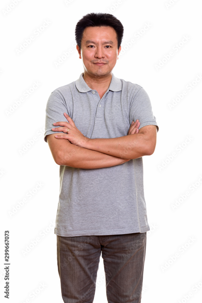 Studio shot of Japanese man isolated against white background Studio shot of Japanese man isolated against white background