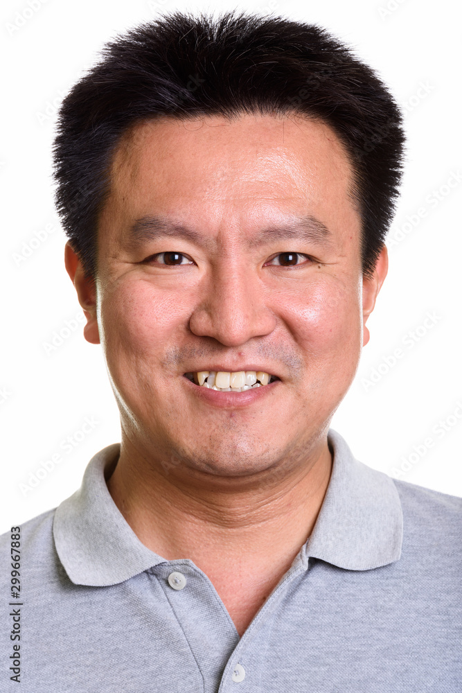 Studio shot of Japanese man isolated against white background Studio shot of Japanese man isolated against white background