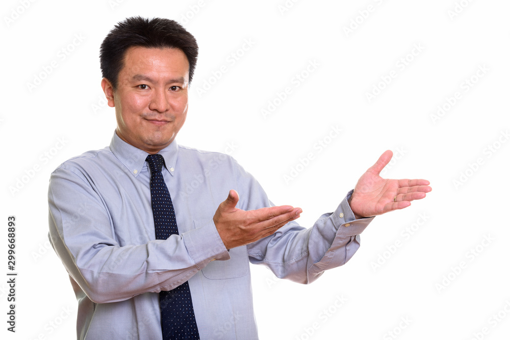 Studio shot of Japanese man isolated against white background Studio shot of Japanese man isolated against white background