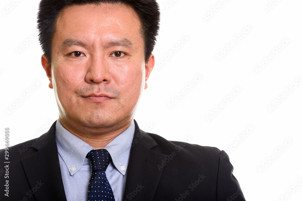 Studio shot of Japanese man isolated against white background Studio shot of Japanese man isolated against white background